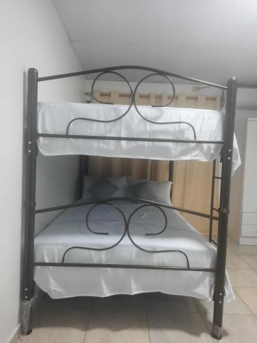 a couple of bunk beds in a room at MiniSuite in Machala