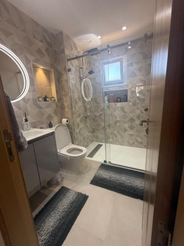 a bathroom with a shower and a toilet at Aqua Vista Retreat in Cabo Negro