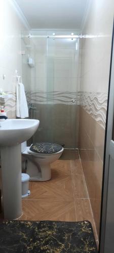 a bathroom with a toilet and a sink at Marhaba in Nador