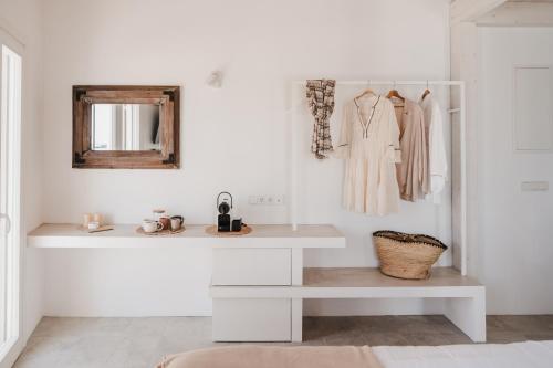 a dressing room with a mirror and a dressing table at Stella Maris in Pythagoreio