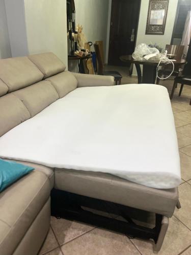 a bed sitting on top of a couch in a living room at Las Palomas Beach & Golf Resort in Puerto Peñasco