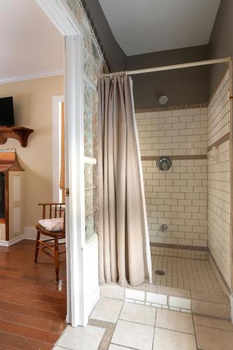 a bathroom with a shower with a shower curtain at Port Albert Inn in Port Albert