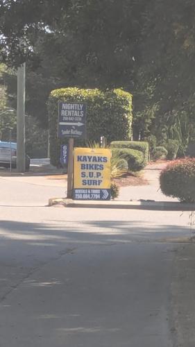 a couple of signs sitting on the side of a street at Davidson Star in Sooke