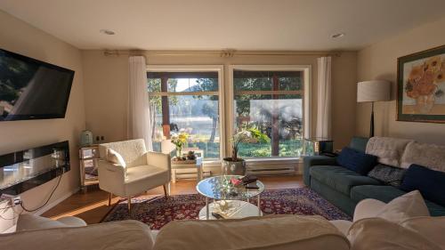 a living room with a couch and a table at Davidson Star in Sooke