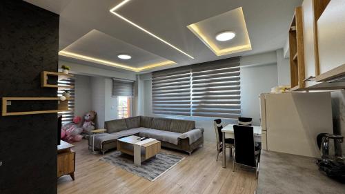 a living room with a couch and a table at The Urban Nest Central Skopje Cozy 2BR Ap in Skopje