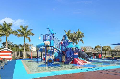 a large water park with a water slide at Oaks Family Getaway - Resort, Beach in Golden Beach