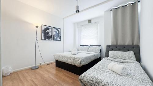 Postel nebo postele na pokoji v ubytování Central London rooms EC1V