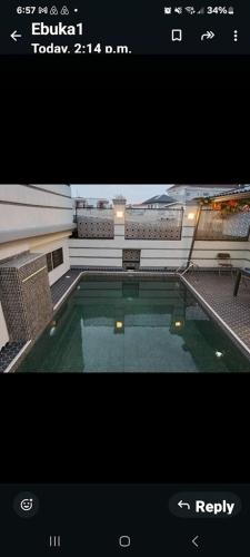 a picture of a swimming pool in a building at Caesar's Hotel & Apartment Room 6 in Ikeja