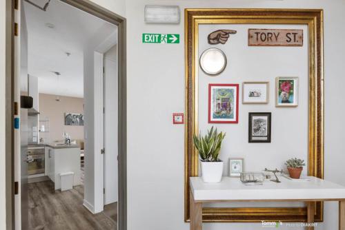 a bathroom with a mirror and a sink in a room at Sunny and Central Wellington Apartment in Wellington