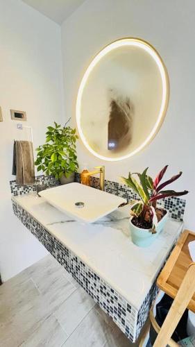 a bathroom with a sink and a mirror at Room 78 in Coquimbo