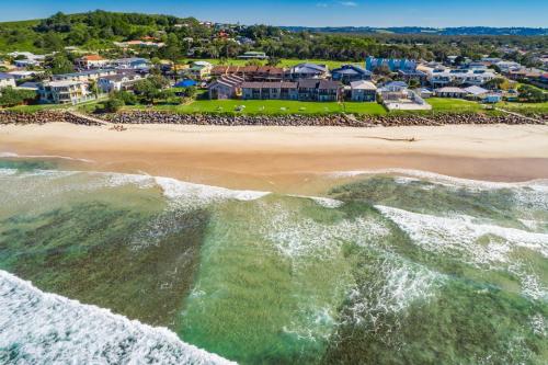 an aerial view of a beach with condos at Absolute Beachfront Apartment 1T in Lennox Head