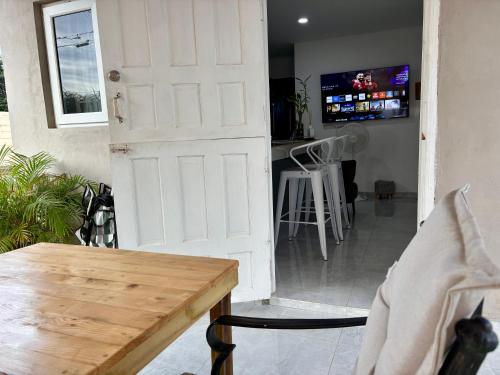a door leading into a kitchen with a bar at The Almas Apartment in Willemstad