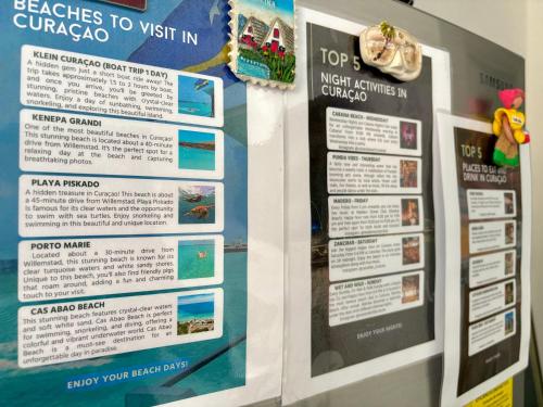 a poster for a trip to guatemala on a wall at The Almas Apartment in Willemstad