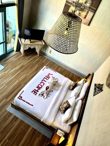 a bed with a happy new year sign on it at The Reward Villas Kerobokan in Seminyak