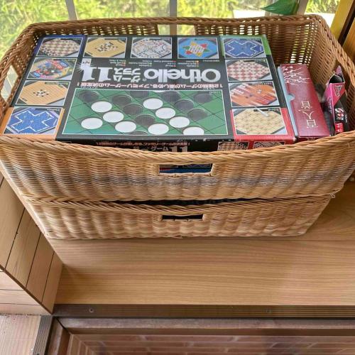 a basket sitting on top of a wooden drawer at With BBQ terrace & dog run A private house full of fun, right by the sea and surf spots in Kashima