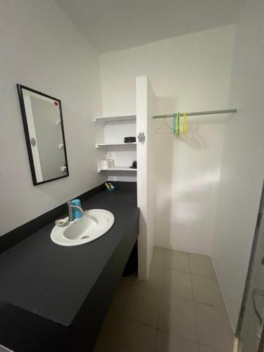 a bathroom with a sink and a mirror at Tropical Paradise Leelawadee Resort in Ko Chang