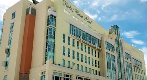 a building with a sign on the top of it at Kiulap Plaza Hotel in Bandar Seri Begawan