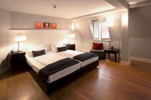 Cama ou camas em um quarto em Hotel Victoria