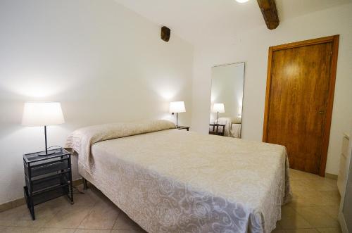 a bedroom with a bed and a wooden door at Cà Marin in Venice