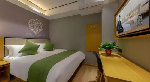 Ένα ή περισσότερα κρεβάτια σε δωμάτιο στο Shell Hotel Anhui Huaibei Railway Station Huiyuan Road