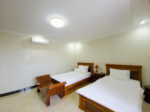 Sat Chamroeun Residenceにあるベッド