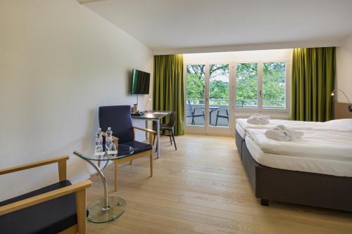 Postel nebo postele na pokoji v ubytování VitalBoutique Hotel Zurzacherhof