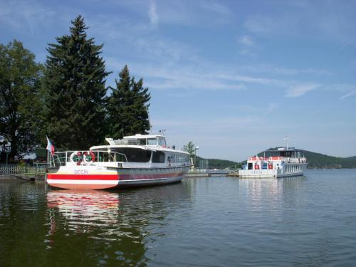 two boats are docked in a body of water at Pension Fami Retro Design in Staré Splavy