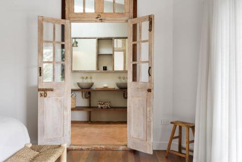 an open door into a bathroom with a sink at The Cleeves in Federal