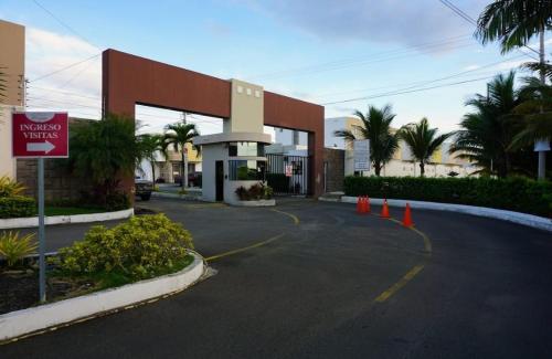 a gas station with orange cones in front of it at Habitaciones en casa de Mari en Manta in Manta