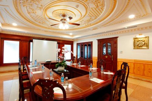 a conference room with a table and a ceiling at New Pacific Hotel in Ho Chi Minh City