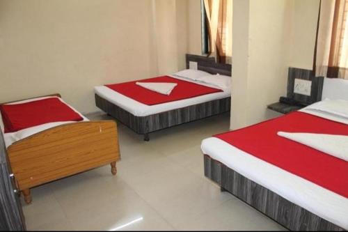 Sai bhagwan budget hotelにあるベッド