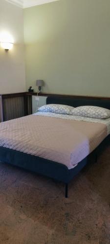 a large bed in a bedroom with a mattressvisor at Alloggio Turistico Casa Vela in Anzio