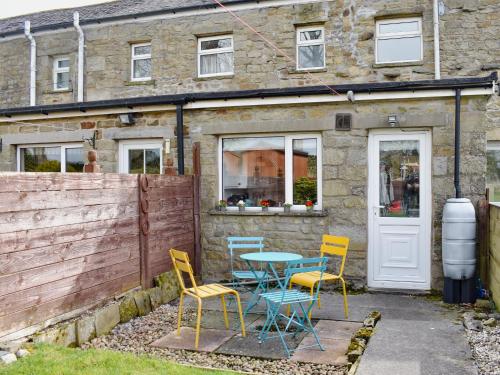 a table and chairs in front of a building at Number 3 Uk33333 in Newby