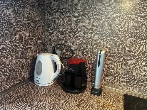 a kitchen counter with a coffee maker and a toaster at Varna Cathedral Apartments in Varna City