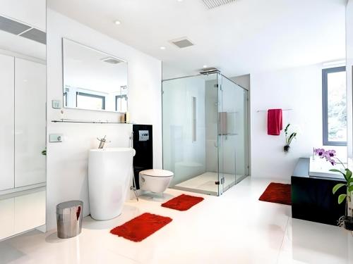 a bathroom with a glass shower and a toilet at Villa181 in Ko Lanta Yai