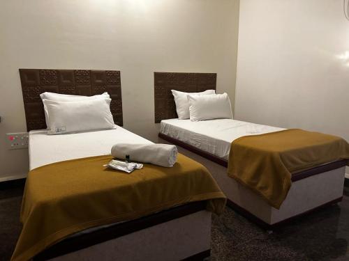 Cama o camas de una habitación en MPS Sai Palace