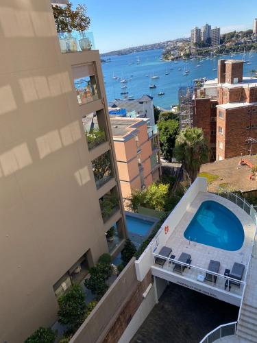 arial view of a building with a swimming pool at By the Harbour Gem in Sydney