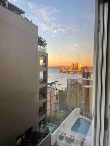 a view from a building with a view of the water at By the Harbour Gem in Sydney