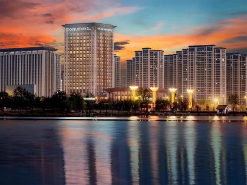 a view of a city skyline with a large building at Doubletree By Hilton Kaifeng in Kaifeng