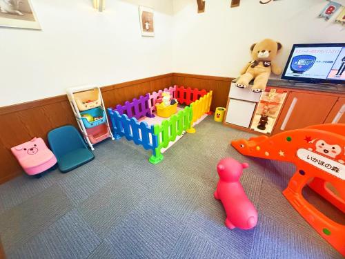 a toy room with a crib and toys in it at Ikaho Kids Paradise Hotel - Vacation STAY 56430v in Shibukawa