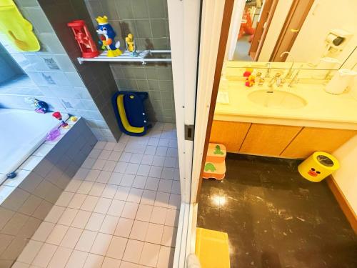 a bathroom with a shower and a sink and a tub at Ikaho Kids Paradise Hotel - Vacation STAY 56430v in Shibukawa