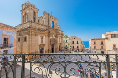 a view of a church from a balcony at !!! AL DUOMO !!! Dimora Storica in Prestigiosa Location in Sciacca