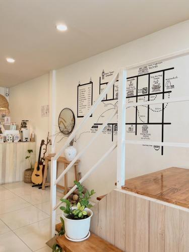 a staircase with a diagram on the wall at LAIWAII HOME in Hat Yai