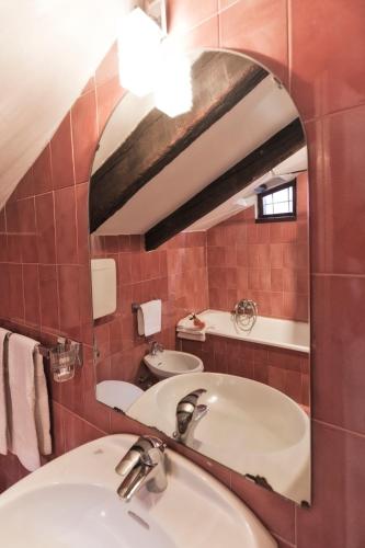 a bathroom with a sink and a mirror at Palazzetto San Lio, Rialto in Venice