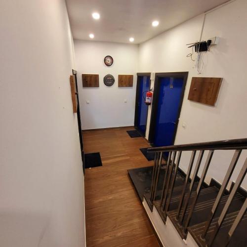 a hallway with two elevators and a stairway with at Rankk Stays in Arambol