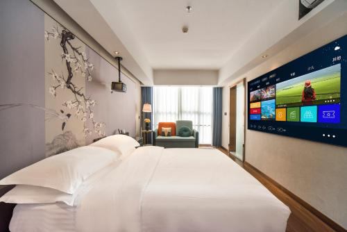 Postel nebo postele na pokoji v ubytování Urba International Apartment in Chaozhou Ancient City People's Square Branch