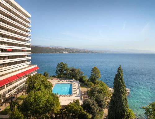a view of the ocean from a building at Hotel Ambasador - Liburnia in Opatija