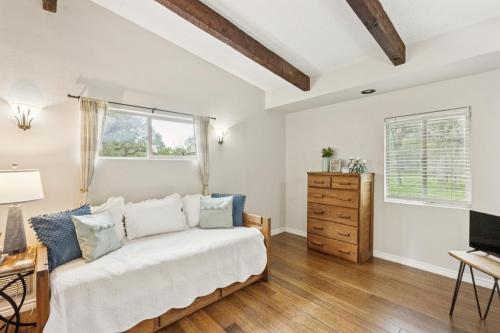 a bedroom with a bed and a dresser at Hill Country Getaway Near San Marcos River home in San Marcos
