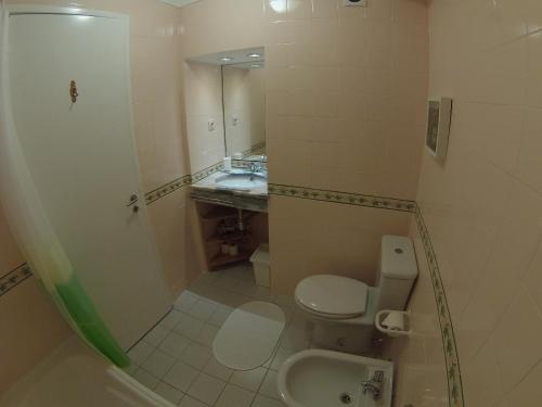 a bathroom with a toilet and a sink at Porto 2 Bedroom Beach Apartment in Matosinhos