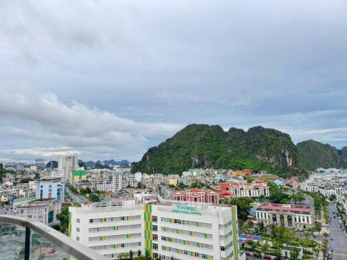 a view of a city with a mountain in the background at Khánh Phong Apartment Premire Sapphire Hòn Gai Hạ Long in Ha Long